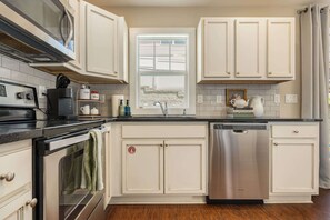 Coffee/tea maker, fridge, microwave, oven