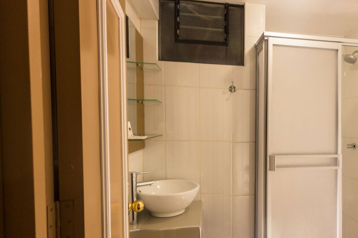 deep-soaking bathtub, rainfall showerhead, free toiletries, towels