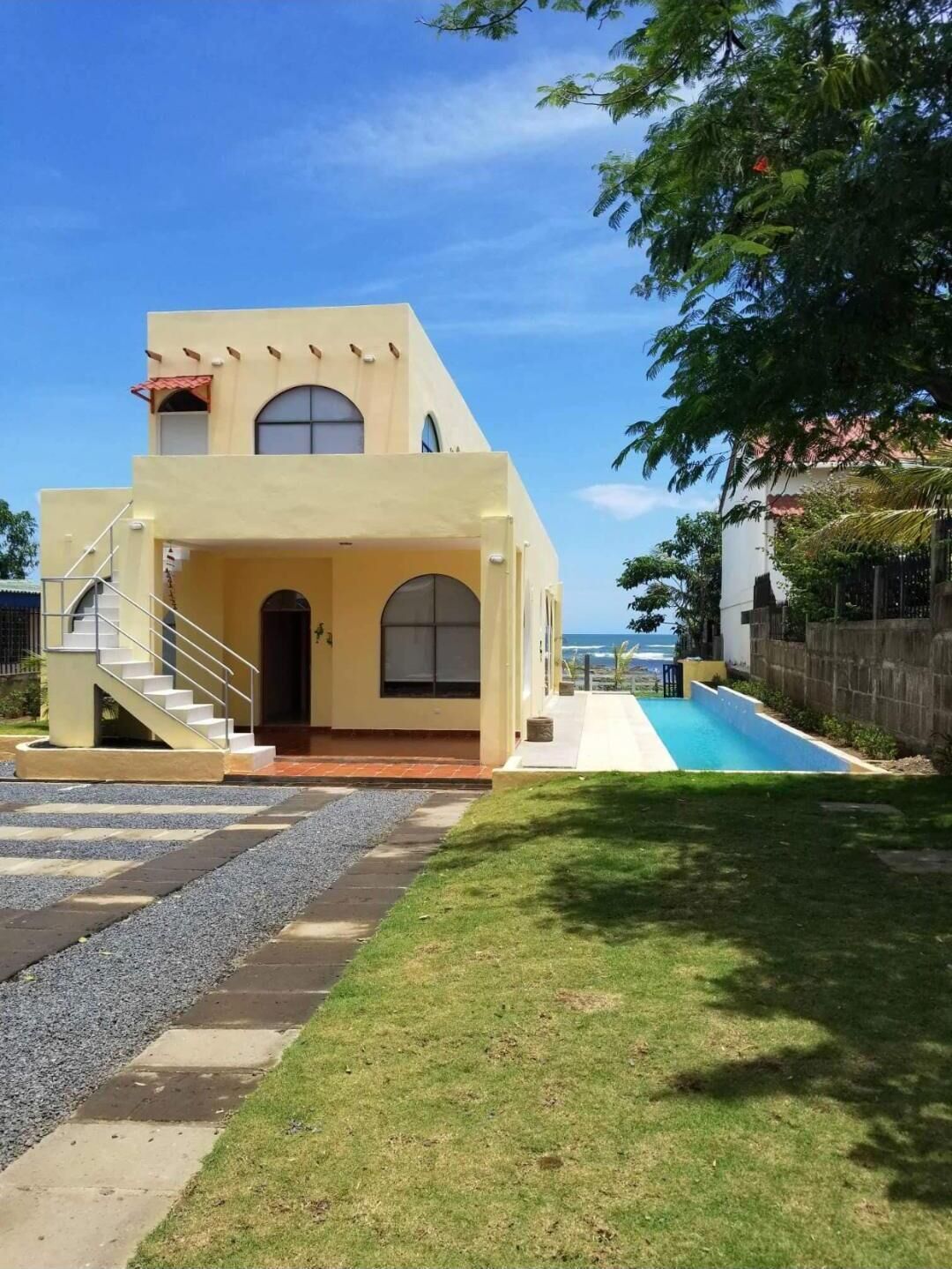 House and pool from entry gate.