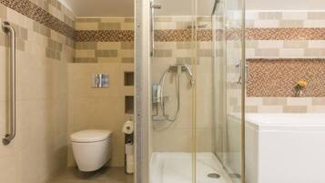 Combined shower/bathtub, hair dryer, bathrobes, towels