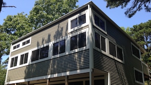 A two-story building with a flat roof and large windows. - Spacious and modern home, close to beach, Tom's Hill private setting. Home AC (Truro)