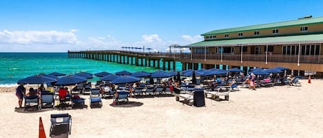 On the beach, sun loungers, beach towels