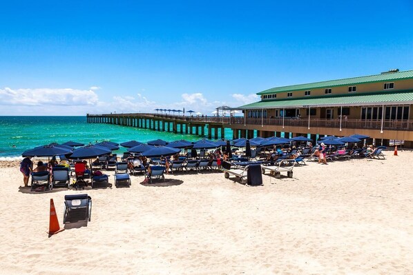 On the beach, sun-loungers, beach towels