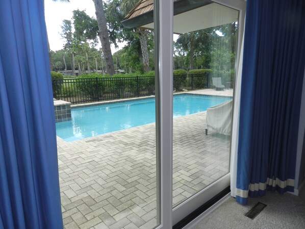 Enjoy the serene view of the pool area from the comfort of your room.
