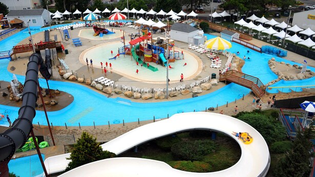 A water park with a large central pool, multiple slides, and a variety of play structures. - Ocean view, FREE BEACH PASS. Short drive to multiple beaches and water park! (Fairhaven)