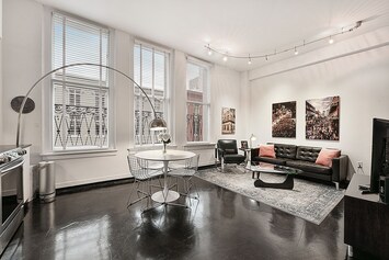 Bright, open living area with view. UHD 4K 50" Smart TV with cable, HBO netflix