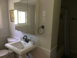 Combined shower/tub, hair dryer, towels, soap