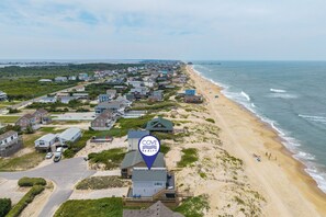 A coastal residential area with houses, a beach, and a pier. - 449 Ocean-Front Amazing Views & Easy Beach Access (Nags Head)