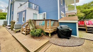 A two-story house with a deck and a covered outdoor grill area. - Just Steps to the Beach! (Virginia Beach)