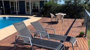 A wooden deck with lounge chairs and a pool. - Amazing Views Pet Friendly Bed and Breakfast (Good Hope)