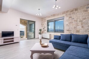 TV, fireplace - Villa Ovgoro – Luxury 3-Level Villa with Heated Pool, Jacuzzi & Panoramic Views (Kamilari)