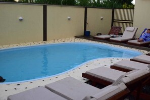 Outdoor pool, pool umbrellas, sun loungers