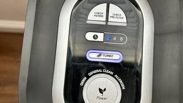 A control panel with buttons labeled "Check Filters," "Check Pre-Filter," and "Turbo" along with a dial marked "2, 4, 8."