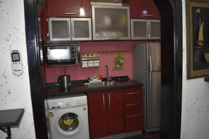 Fridge, oven, electric kettle, cookware/dishes/utensils