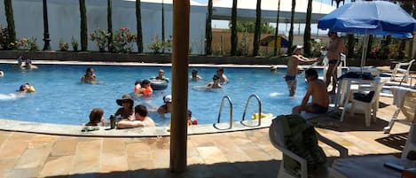 Outdoor pool, a heated pool, sun loungers