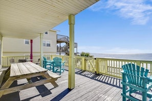 The indoor living area can spill over to the ocean front deck on the main level.