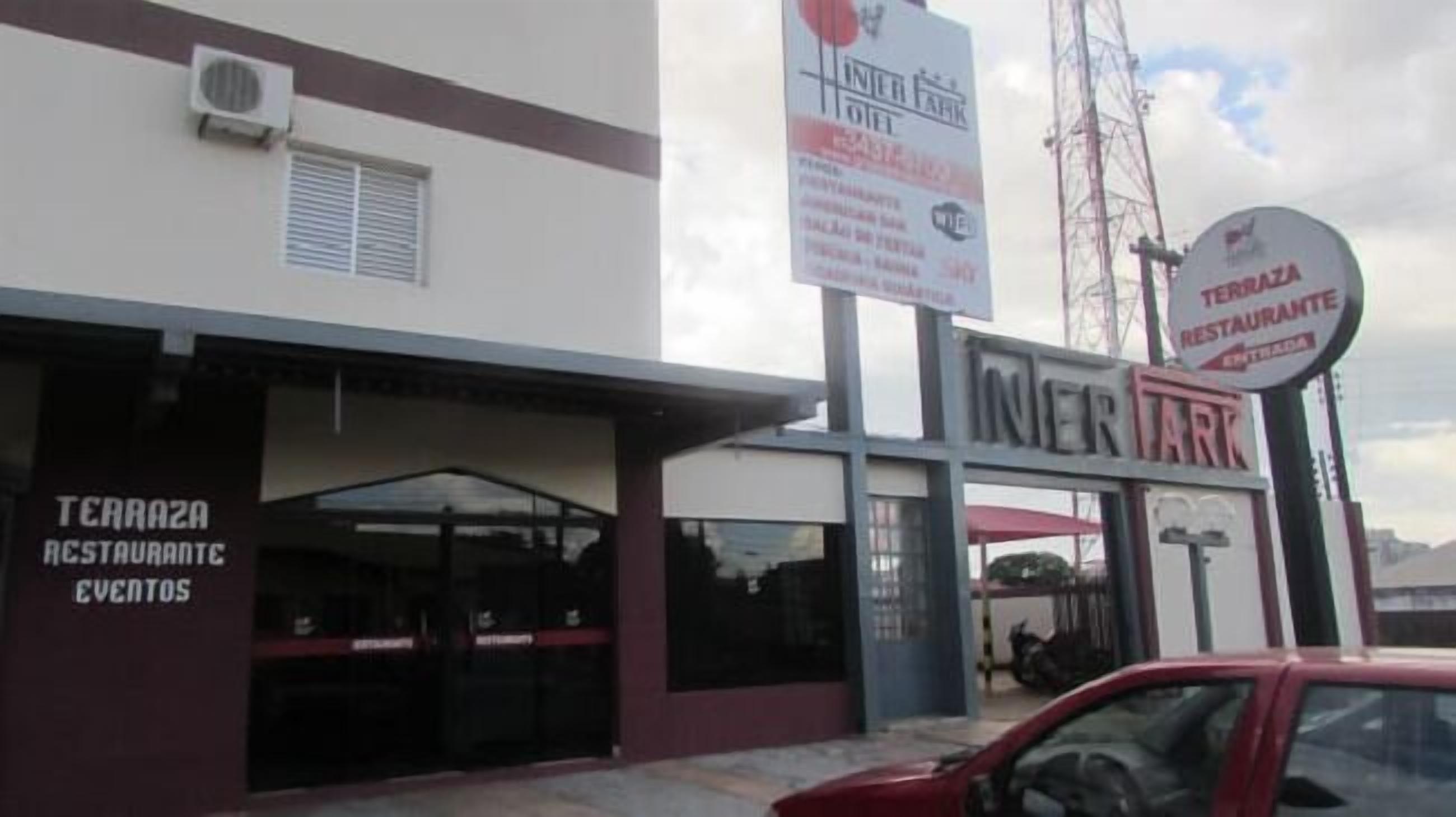 A building with a sign for 'TERRAZA RESTAURANTE' and 'INTERNATIONAL HOTEL'.