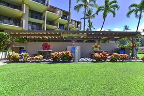 Relax under the pergola, surrounded by lush greenery and vibrant flowers.