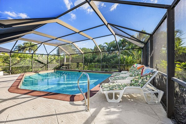 A heated pool, pool loungers