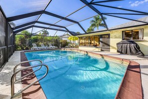 A heated pool, pool loungers