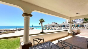 A resort with a pool, lounge chairs, and a view of the ocean. - Villa 5 – Newly Remodeled Oceanfront Luxury Villa (Puerto Peñasco)