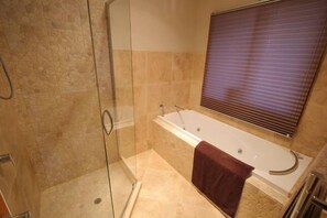 Bathtub, jetted tub, hair dryer, bathrobes