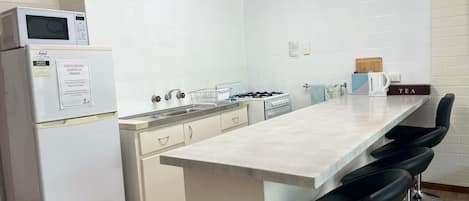 Coffee/tea maker, fridge, microwave, oven