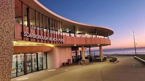 A building with a curved facade, large windows, and a sign reading 'Scarborough Beach Pool'. - West Beach Lagoon 123 - Location &amp; Views!!! (Scarborough)