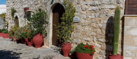 A stone building with a sign reading "Villa Armonia."
