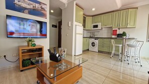 Fridge, microwave, stovetop, coffee/tea maker
