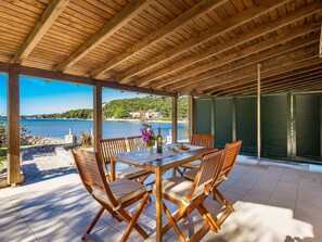 Outdoor dining - Lovely apartment for 6 people with A/C, WIFI, pool, TV and patio (Senj)