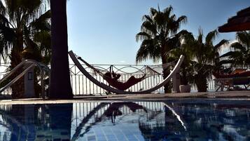 Seasonal outdoor pool, pool loungers