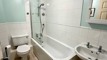 Combined shower/bathtub, hair dryer, towels, soap