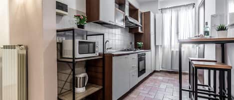 Family Apartment, 3 Bedrooms | Private kitchen | Full-size fridge, microwave, oven, stovetop