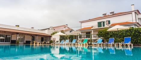 Outdoor pool, pool umbrellas, sun loungers