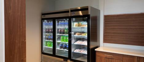 A vending machine with various beverages and snacks.