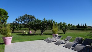 A patio with grey lounge chairs and a pink planter. - House / Villa - CuersHouse with garden (Cuers)