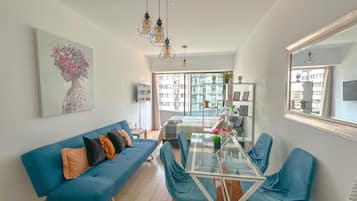 Exclusive Apartment, 1 Bedroom, Non Smoking, City View | Living area | 58-inch Smart TV with cable channels, TV, Netflix
