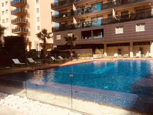 Brand new cozy apartment few steps from the beach, with pool, terrace and WiFi