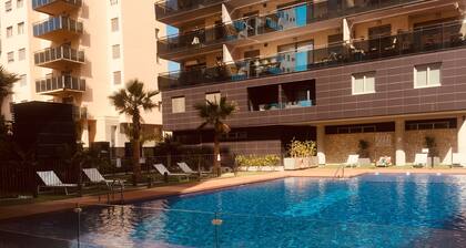 Brand new cozy apartment few steps from the beach, with pool, terrace and WiFi