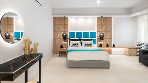 A modern bedroom with a bed, bedside tables, a console table, and a large mirror. -  Elaida Villa, Refined Group Escape • Pool & Play (Rethymno)