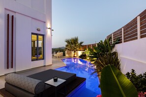 Outdoor pool, a heated pool, sun loungers