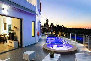 Outdoor pool, a heated pool, sun loungers