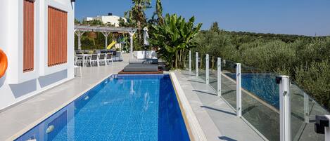 Outdoor pool, a heated pool, pool loungers