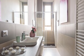 Shower, hair dryer, towels, soap