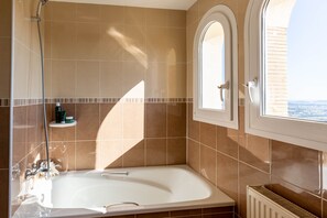 Combined shower/tub, hair dryer, towels, toilet paper