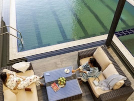 Outdoor pool, open 6:30 AM to 7:00 PM, pool umbrellas