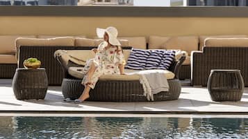 Outdoor pool, open 6:30 AM to 7:00 PM, pool umbrellas