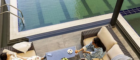 Outdoor pool, open 6:30 AM to 7:00 PM, pool umbrellas