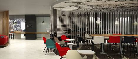 A modern interior with a curved wall, multiple seating areas, and a patterned ceiling.